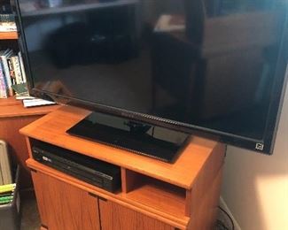 teak entertainment cabinet and large TV