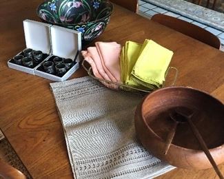 napkins and napkin rings, placemats and a teak salad bowl