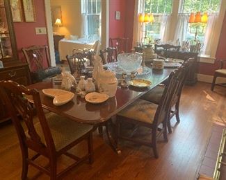 Knob Creek cherry dining table with two leaves and 4 pads, 8 side chairs and 2 arm chairs