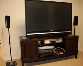 Large Flat Screen TV, Media Shelf, and Pair of Speakers