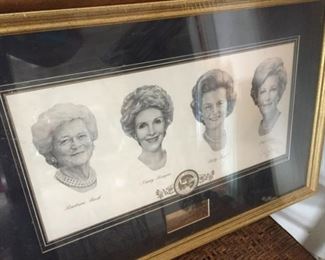 Framed portraits of First Ladies.