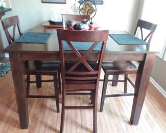 Great counter height table and four chairs with built in leaf