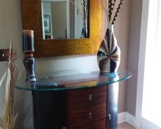 Stunning entry piece is a buffet, wine rack and more with glass top
