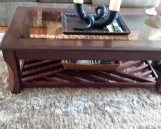 Great condition glass top coffee table with decorative horn like piece