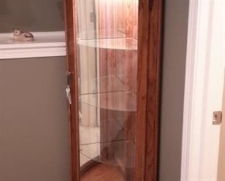 Lighted solid oak curved glass corner curio with lock and key (not all contents for sale).