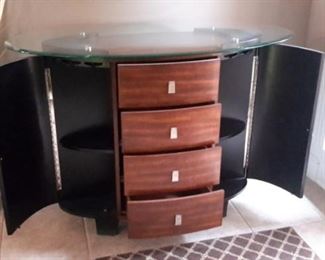 Stunning entry piece is a buffet, wine rack and more with glass top