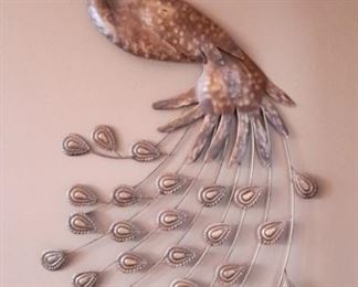 Metal peacock wall hanging.