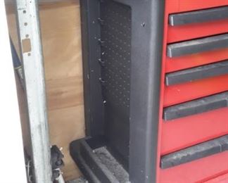 Craftsman tool chest with casters, peg boards on the side and added ceramic tile on top.