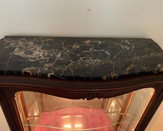 Marble top that removes when wanting to move the cabinet 