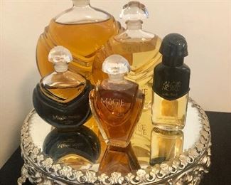 Magie Noire perfume bottles including rare department store facticr, mirrored footed tray