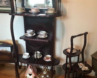 Victorian stand with mirror, tea cups and saucers