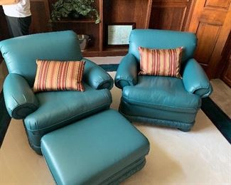 Teal green leather chairs and ottoman