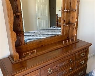 Queen size bedroom set has dresser with mirror and shelves, night stand