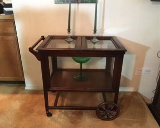 Ferguson Brothers Serving Cart with Glass all around. The Two Top Trays are removable. Glass Art and Candlesticks.
Lot Number: 2