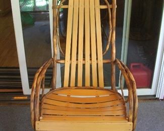 Comfortable porch rocker.  This is really a cool chair.  It needs a new home though.