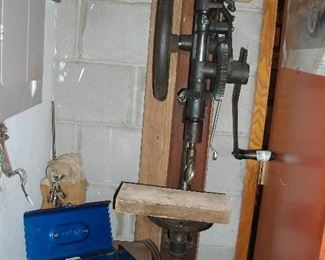 Really cool drill press.  It can be yours if you remove it from the wall.  Works great!