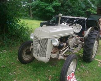 1952 Ford tractor.  It comes with a plow and with chains.