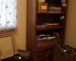 bookcase, sewing and quilting books, luggage