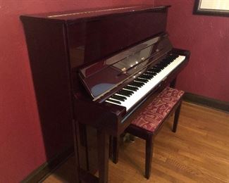 Samick full upright piano with bench.  Beautiful lacquered mahogany finish.  