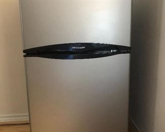 Office/dorm/apartment sized Frigidaire  Frost-free refrigerator with separate freezer compartment.