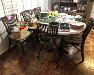 Round table with 6 Rattan chairs