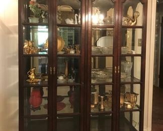 Exceptional beveled glass four door display cabinet