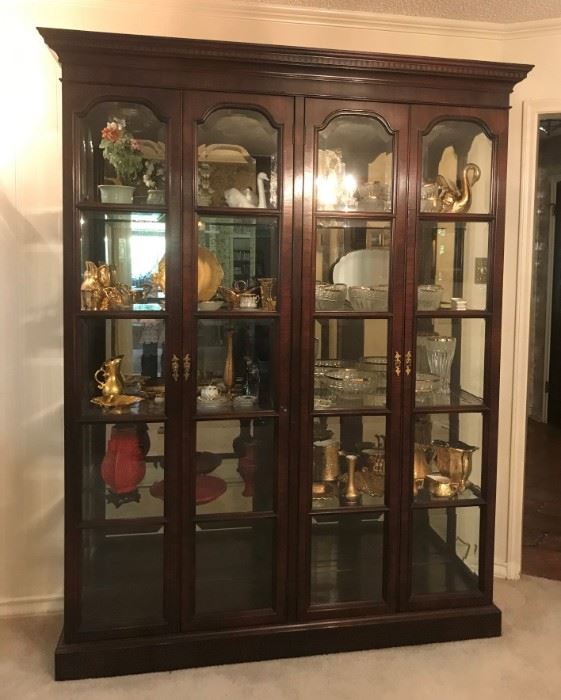 Exceptional beveled glass four door display cabinet