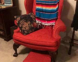 Oversize red wing back chair with matching ottoman. 