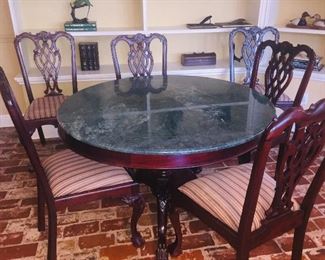 Marble top dining table with six chairs (leaves have been removed but can be added to make a larger table)