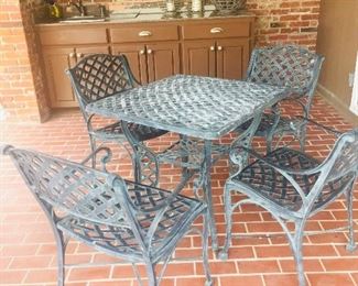 small wrought iron patio table and chairs