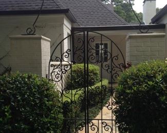 Please enter the front door----not this side gate.