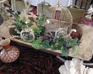 This wooden trough provides unique display area for many treasures.