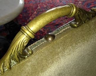 . . . and topped with a brass handle.