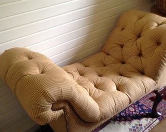 Tufted gold bed bench with curved sides