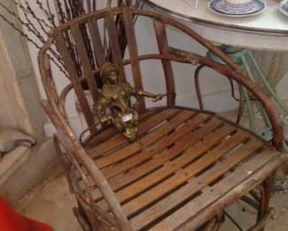One of two barrel back wooden chairs