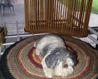 Small dog on braided rug