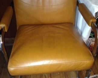 One of two carmel colored chairs