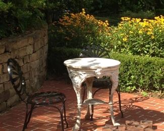 2 black patio chairs; 1 small white patio table