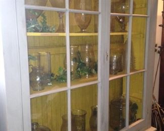 French Country hutch filled with apothecary jars