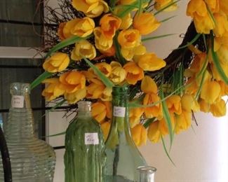 Yellow tulip wreath; miscellaneous bottle "vases"