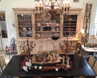 The antique wall unit has an incredible amount of display and storage areas.