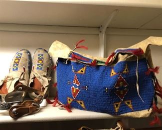 Moccasins, spurs, and a fine burden bag.