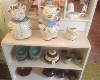 Shawnee smiling pig cookie jars and creamer. Also have salt and pepper.
