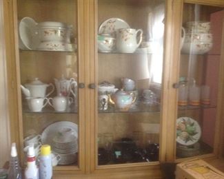 Jewel tea pieces and other sets of tea pots and cups.  Sitting inside a vintage China cabinet.  Glass doors on top and wooden doors on bottom.  Presale..$125