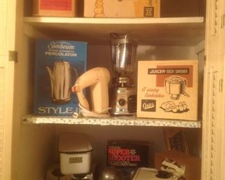 Vintage small appliances in their original boxes