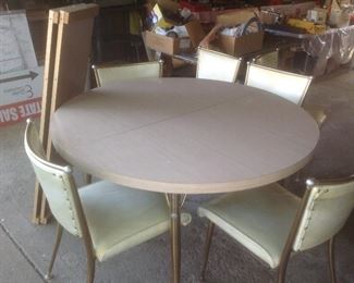 Vintage Formica table with two leaves and six chairs...presale $195