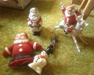 Four very old Xmas pieces...three are electric but without a light....Santa in upper left is a vintage planter