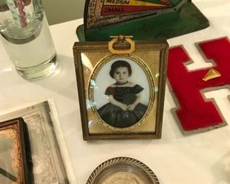Portrait painted on glass under a convex glass frame, old egg scale, sterling dish, bisque baby doll