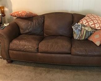 Another view of leather sofa with nail head trim
