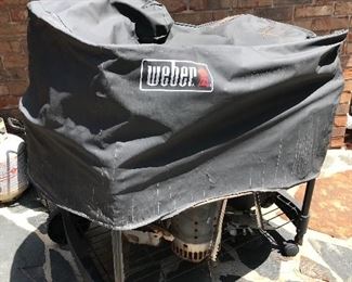 Weber kettle grill on rolling stand